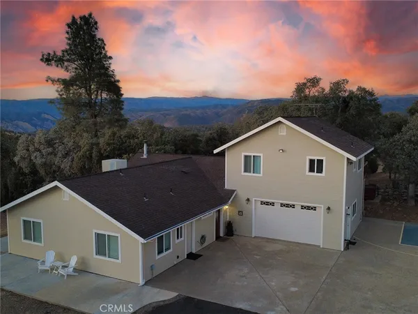 a aerial view of house with a yard