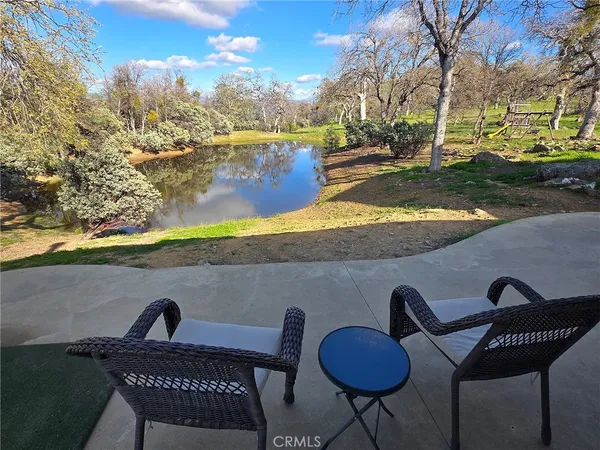 a view of a chairs and table in the patio
