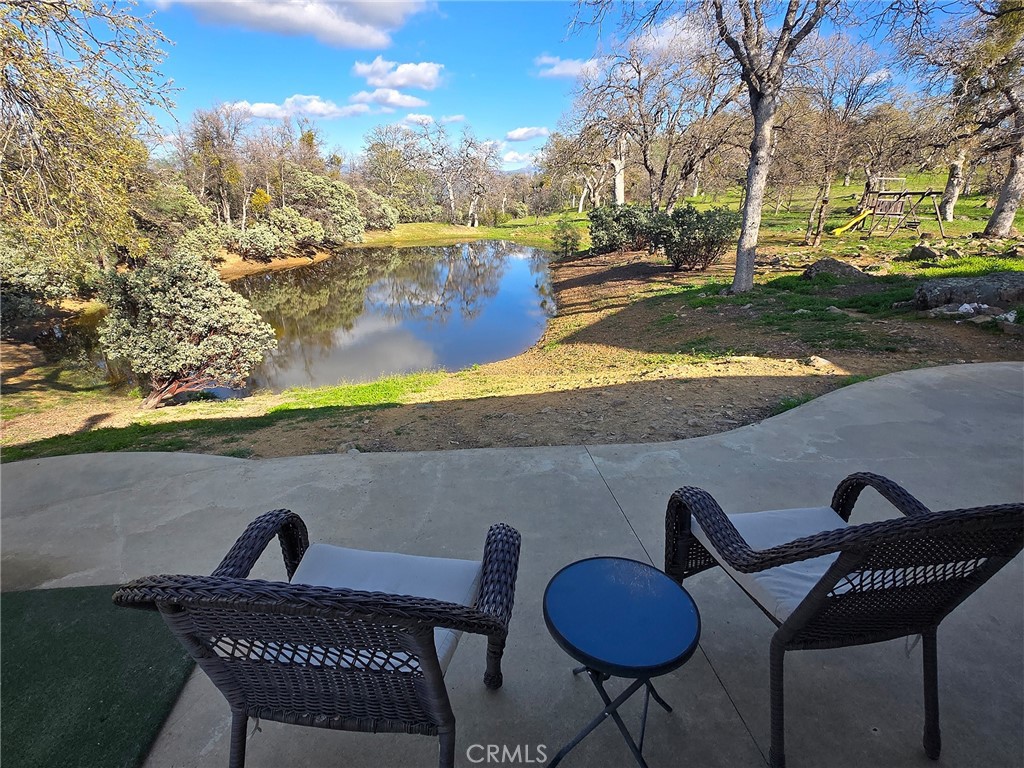 6097 Sherlock Road Midpines, CA 95345 - Photo 8 of 37 a view of a chairs and table in the patio