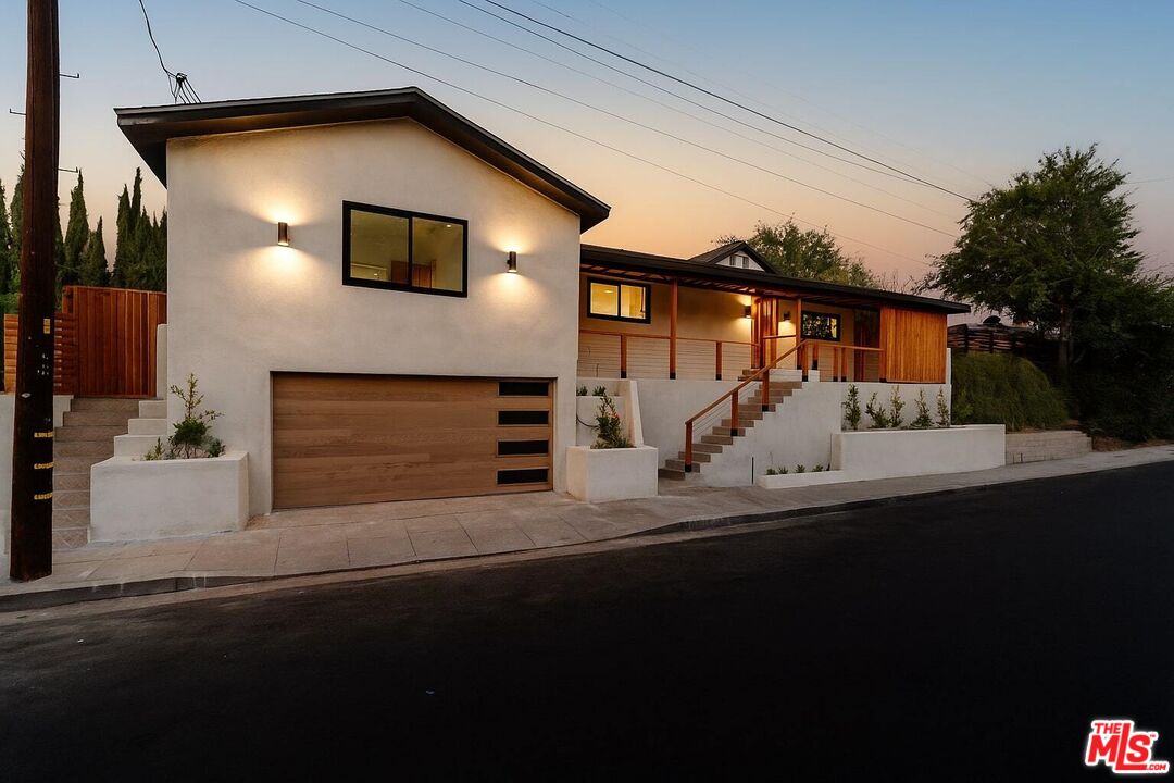 576 Neva Place Los Angeles, CA 90042 - Photo 1 of 1 a front view of a house with garage