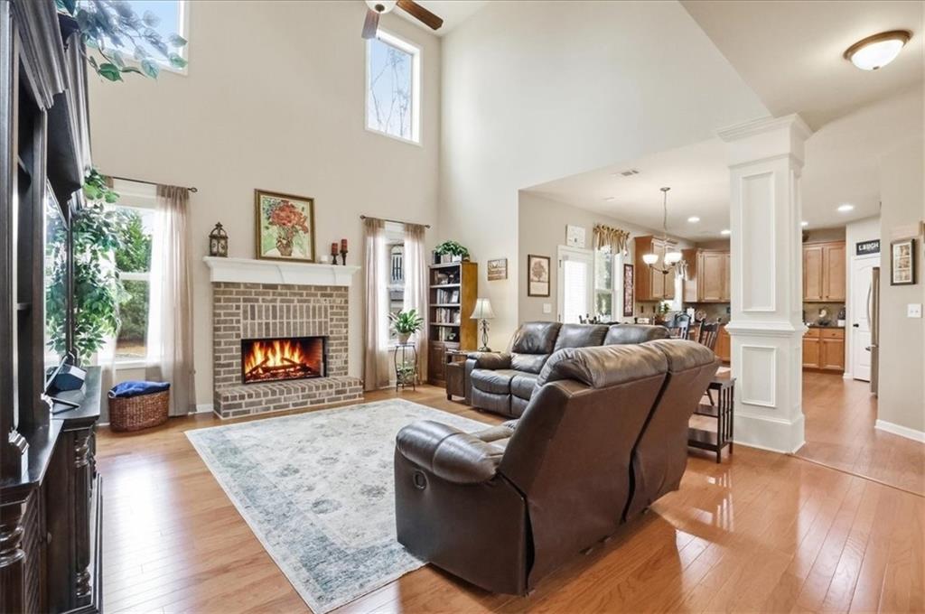 525 Widgeon Way Jefferson, GA 30549 - Photo 13 of 65 a living room with furniture and a fireplace