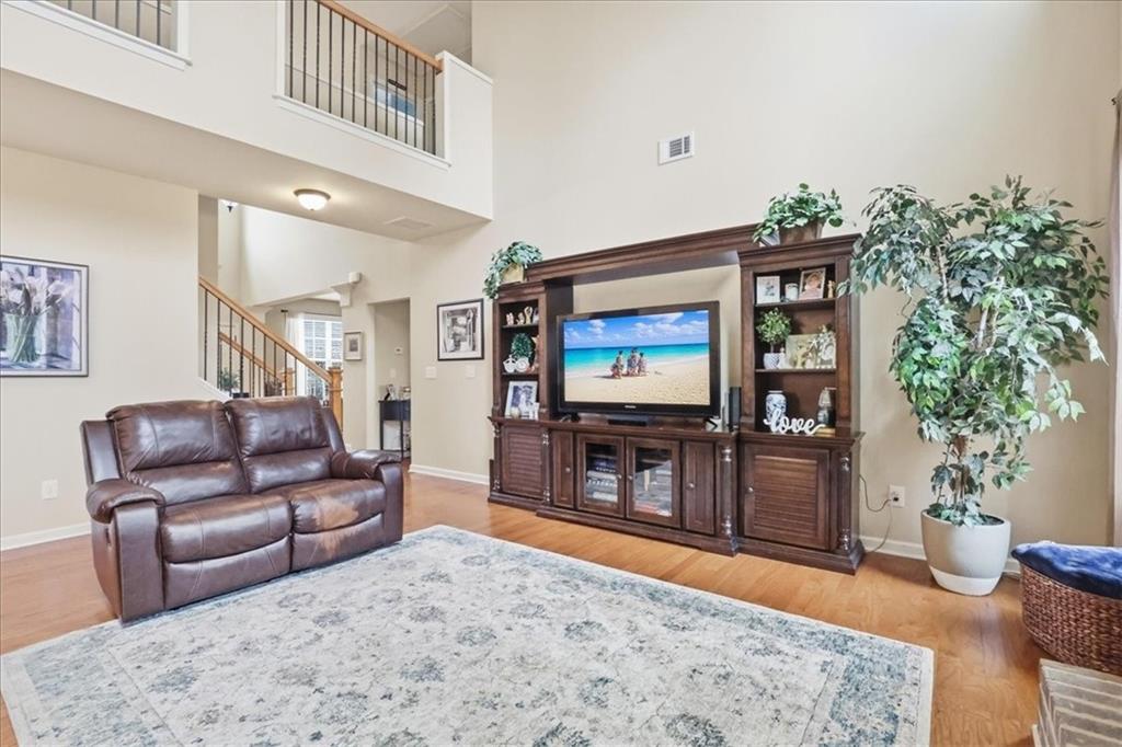 525 Widgeon Way Jefferson, GA 30549 - Photo 16 of 65 a living room with furniture and a flat screen tv