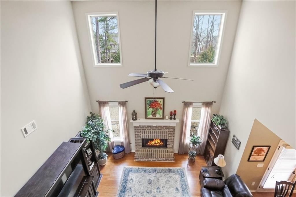 525 Widgeon Way Jefferson, GA 30549 - Photo 17 of 65 a living room with furniture and a fireplace
