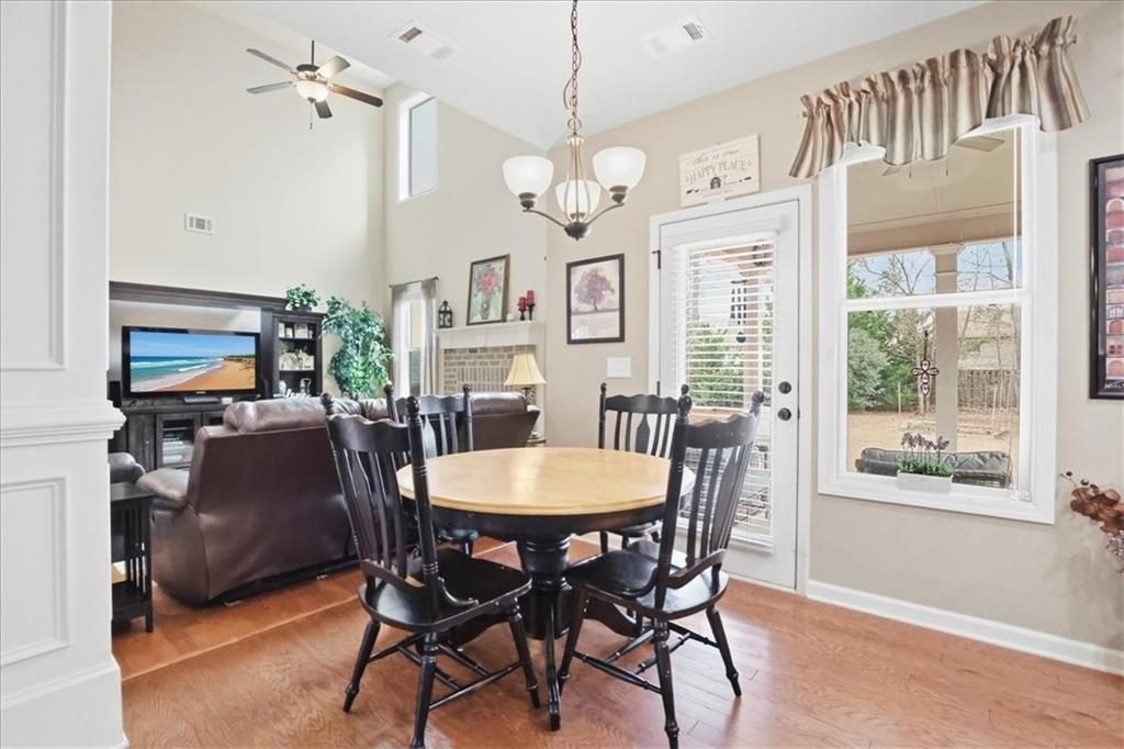 525 Widgeon Way Jefferson, GA 30549 - Photo 19 of 65 a view of a dining room with furniture window and wooden floor