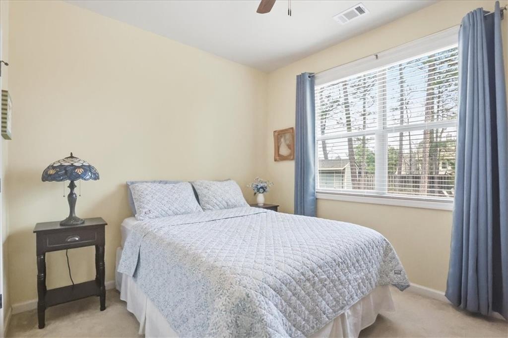 525 Widgeon Way Jefferson, GA 30549 - Photo 28 of 65 a bedroom with a bed and a window