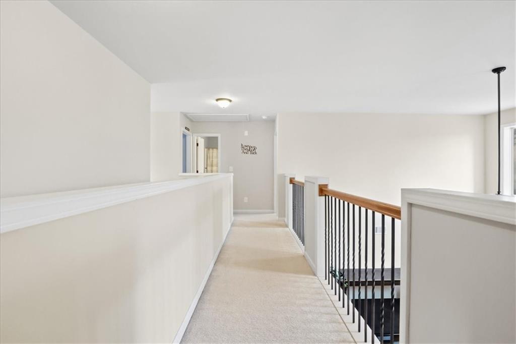 525 Widgeon Way Jefferson, GA 30549 - Photo 31 of 65 a view of a hallway with wooden floor and windows