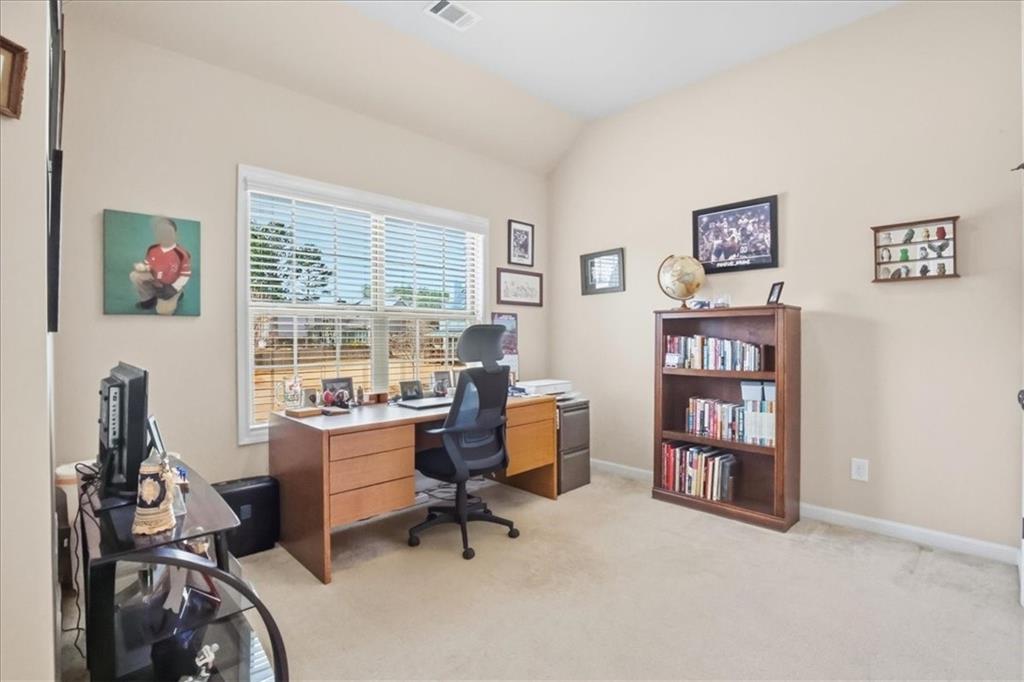 525 Widgeon Way Jefferson, GA 30549 - Photo 32 of 65 a view of a workspace with lounge chair and a window