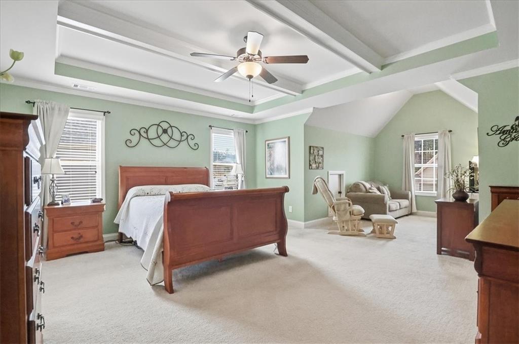 525 Widgeon Way Jefferson, GA 30549 - Photo 40 of 65 a bedroom with a bed couch chandelier and a window