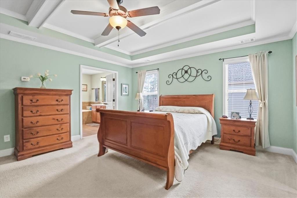 525 Widgeon Way Jefferson, GA 30549 - Photo 42 of 65 a bedroom with a bed and a dresser