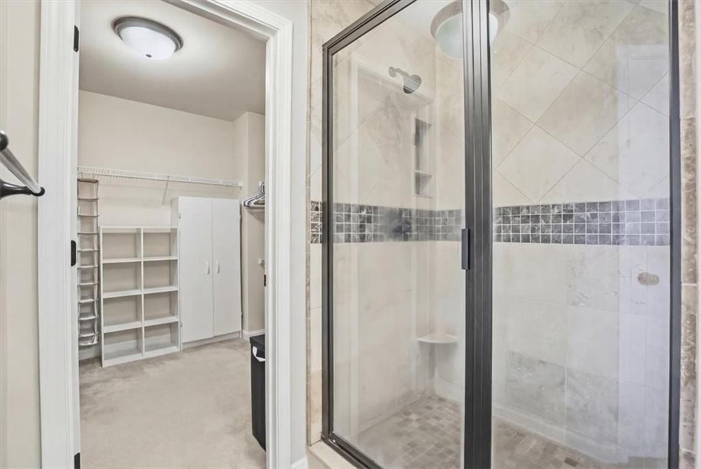 525 Widgeon Way Jefferson, GA 30549 - Photo 52 of 65 a bathroom with a glass shower door