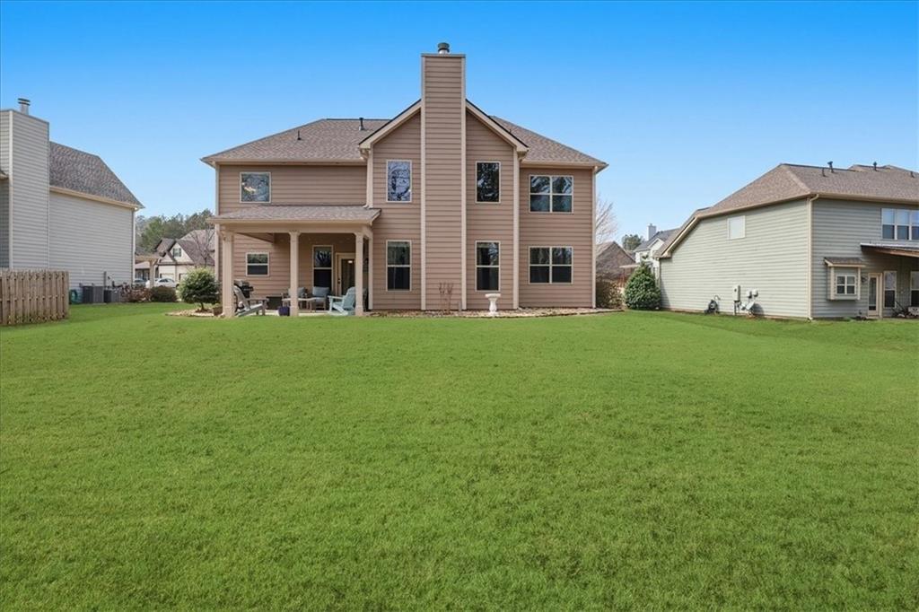 525 Widgeon Way Jefferson, GA 30549 - Photo 56 of 65 a view of a house with a yard and sitting area