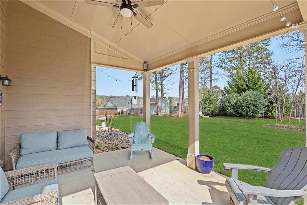 525 Widgeon Way Jefferson, GA 30549 - Photo 59 of 65 a view of a patio with couches plants and garden
