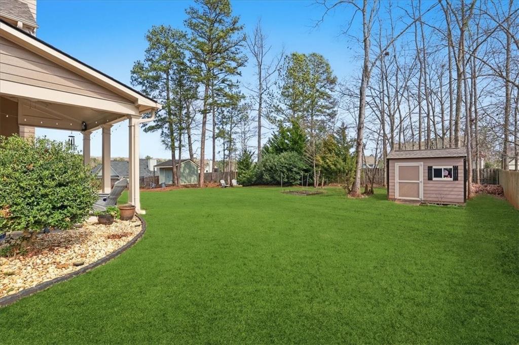 525 Widgeon Way Jefferson, GA 30549 - Photo 60 of 65 a view of a house with backyard porch and garden