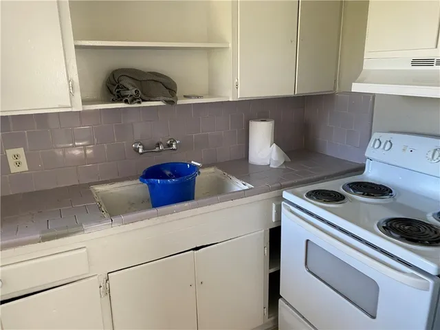 a view of backyard with swimming pool and outdoor seating