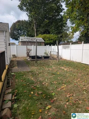 a view of a backyard of the house