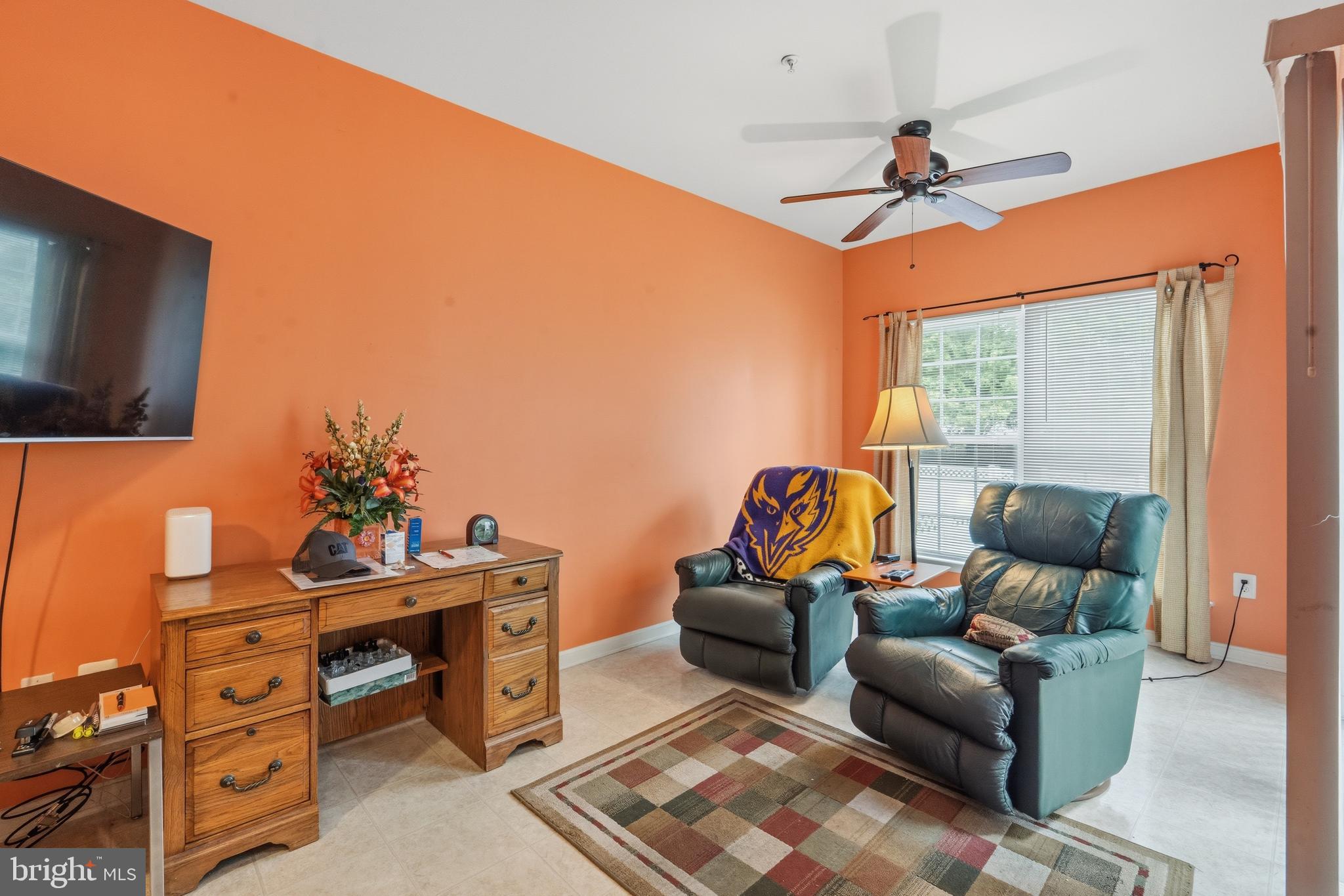 3132 Raking Leaf Drive Abingdon, MD 21009 - Photo 11 of 31 a living room with furniture a ceiling fan and a flat screen tv