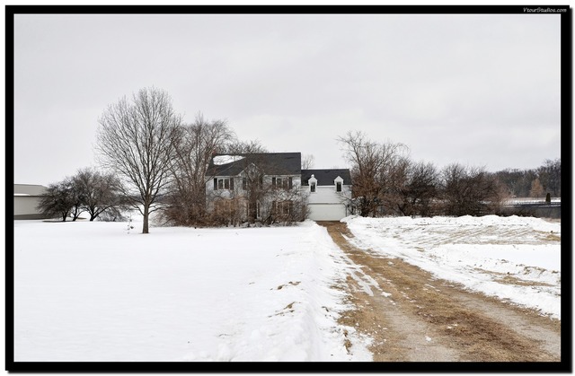 a view of a dry yard covered in snow