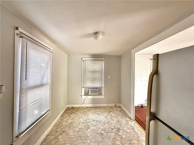 a view of a room with a large window