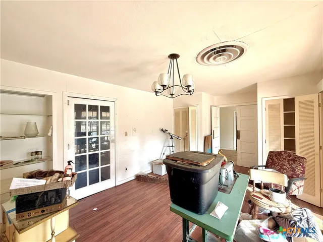 a room with furniture and wooden floor