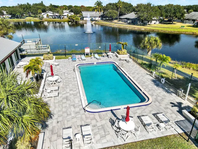 an aerial view of a house with a lake view