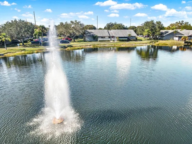 a view of a lake with boats and trees