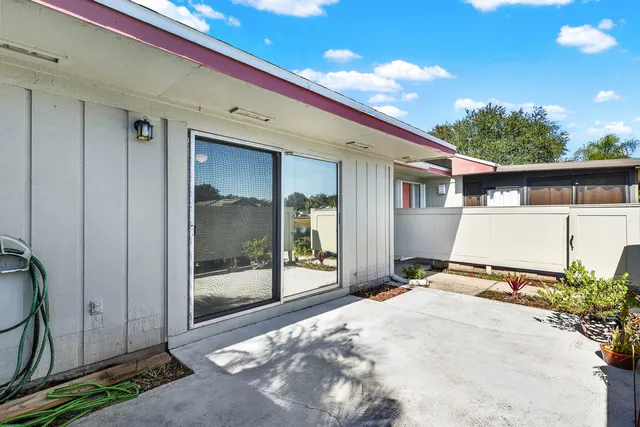 wooden floor in a livingroom and a dining room view