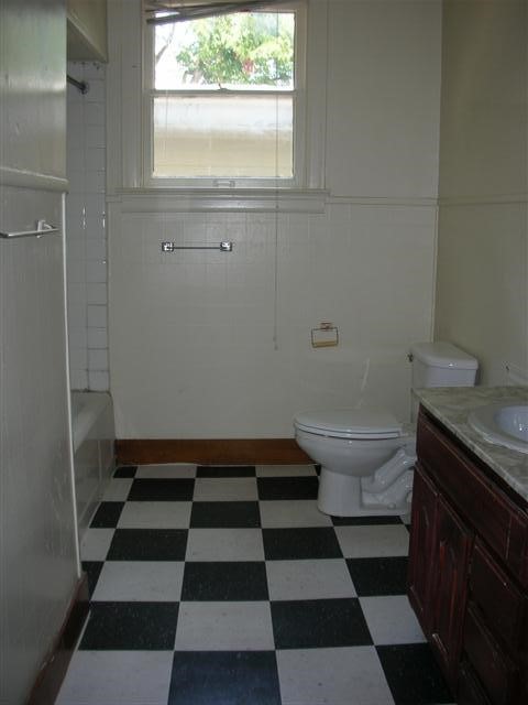 2800 Whitis Avenue, Unit D Austin, TX 78705 - Photo 2 of 6 a bathroom with a black and white checkered floor