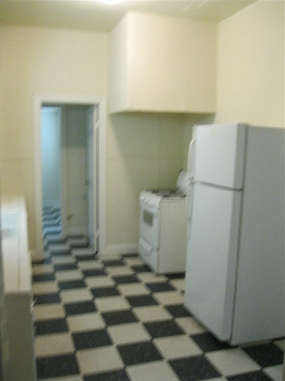 2800 Whitis Avenue, Unit D Austin, TX 78705 - Photo 6 of 6 a room with a refrigerator and a sink
