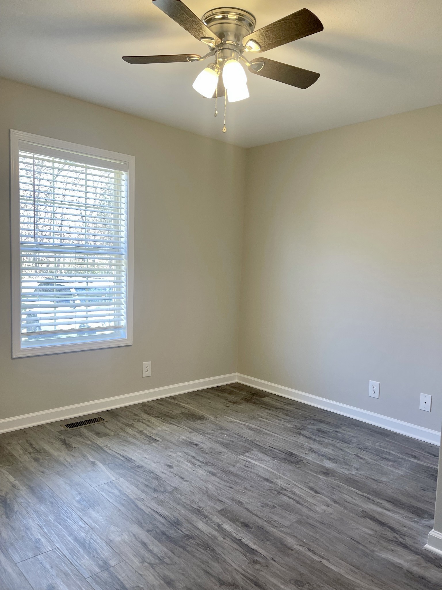 1845 Hugh Hunter Road Oak Grove, KY 42262 - Photo 4 of 6 wooden floor in an empty room with a window