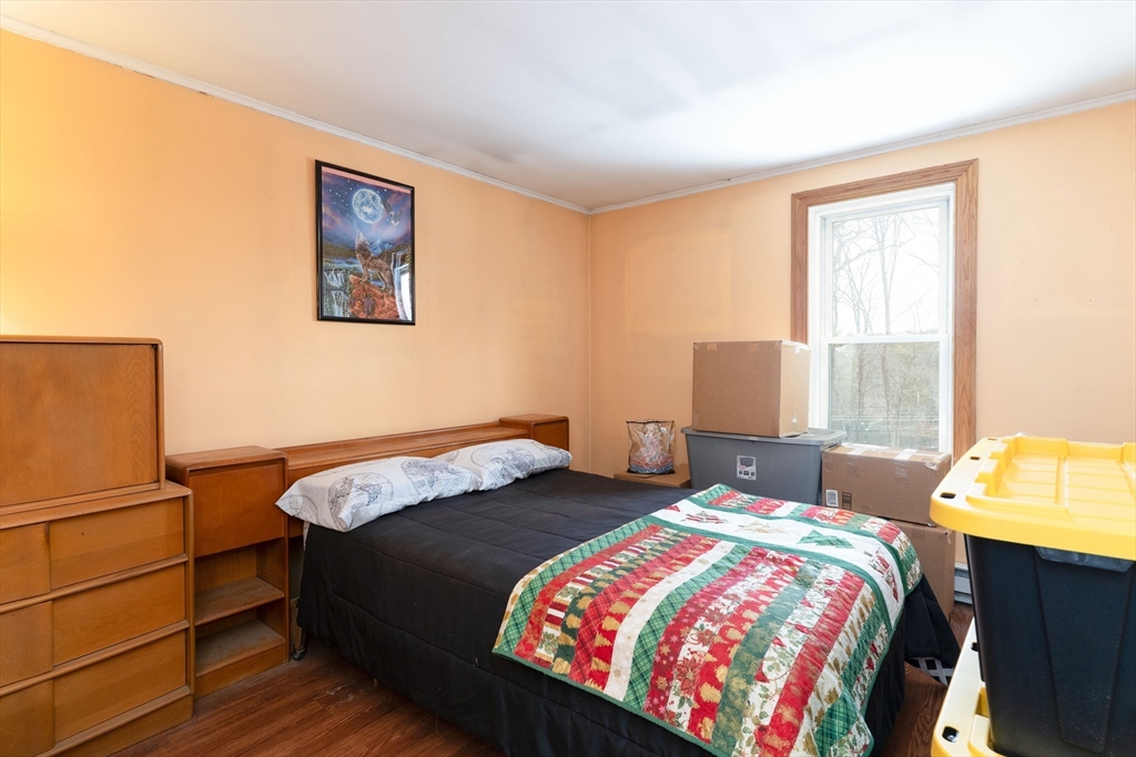 116 Spencer Road Oakham, MA 01068 - Photo 20 of 40 a bedroom with a bed and a window