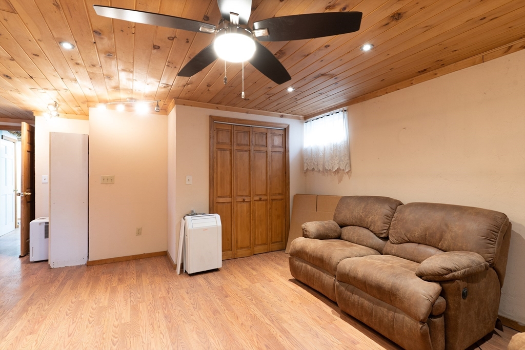116 Spencer Road Oakham, MA 01068 - Photo 23 of 40 a living room with furniture and a ceiling fan
