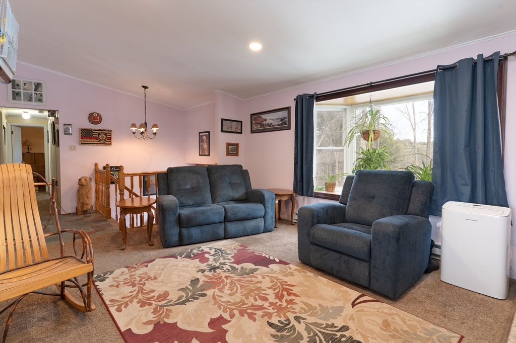 116 Spencer Road Oakham, MA 01068 - Photo 6 of 40 a living room with furniture and a large window