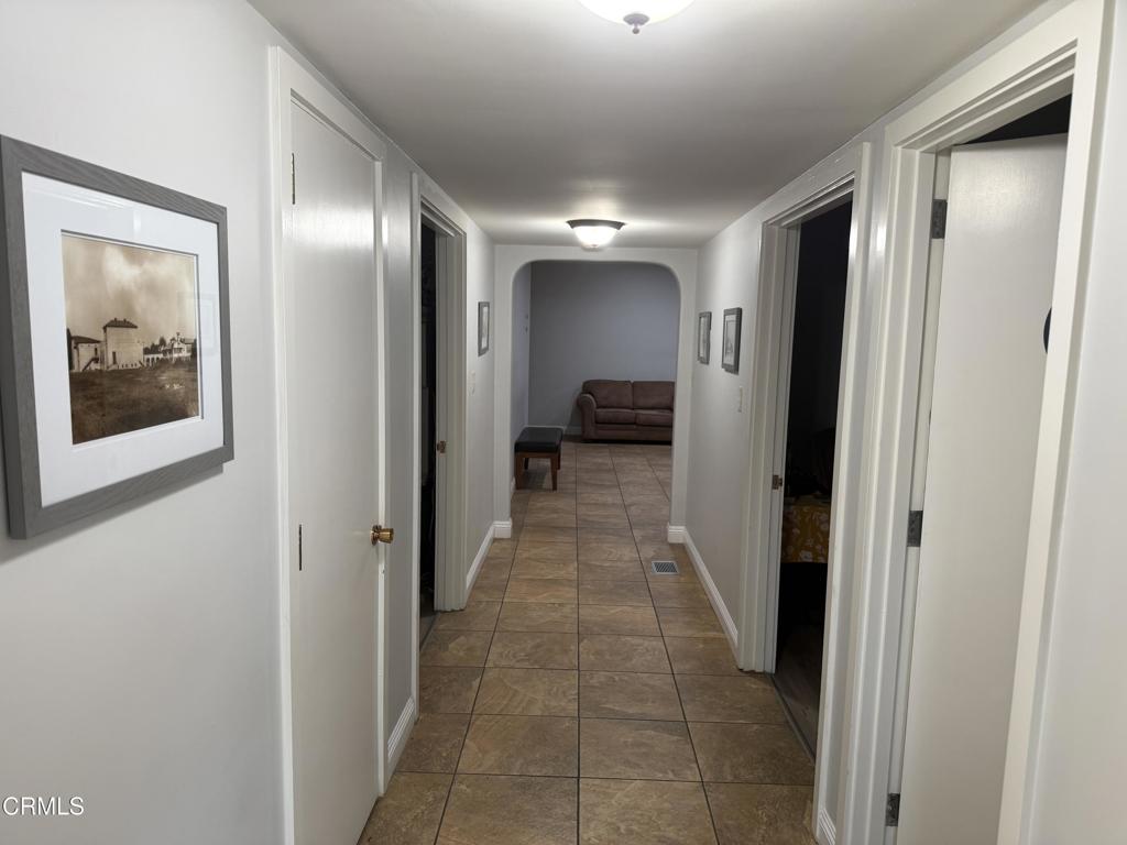 600 Central Street Fillmore, CA 93015 - Photo 8 of 13 a view of a hallway with wooden shelves