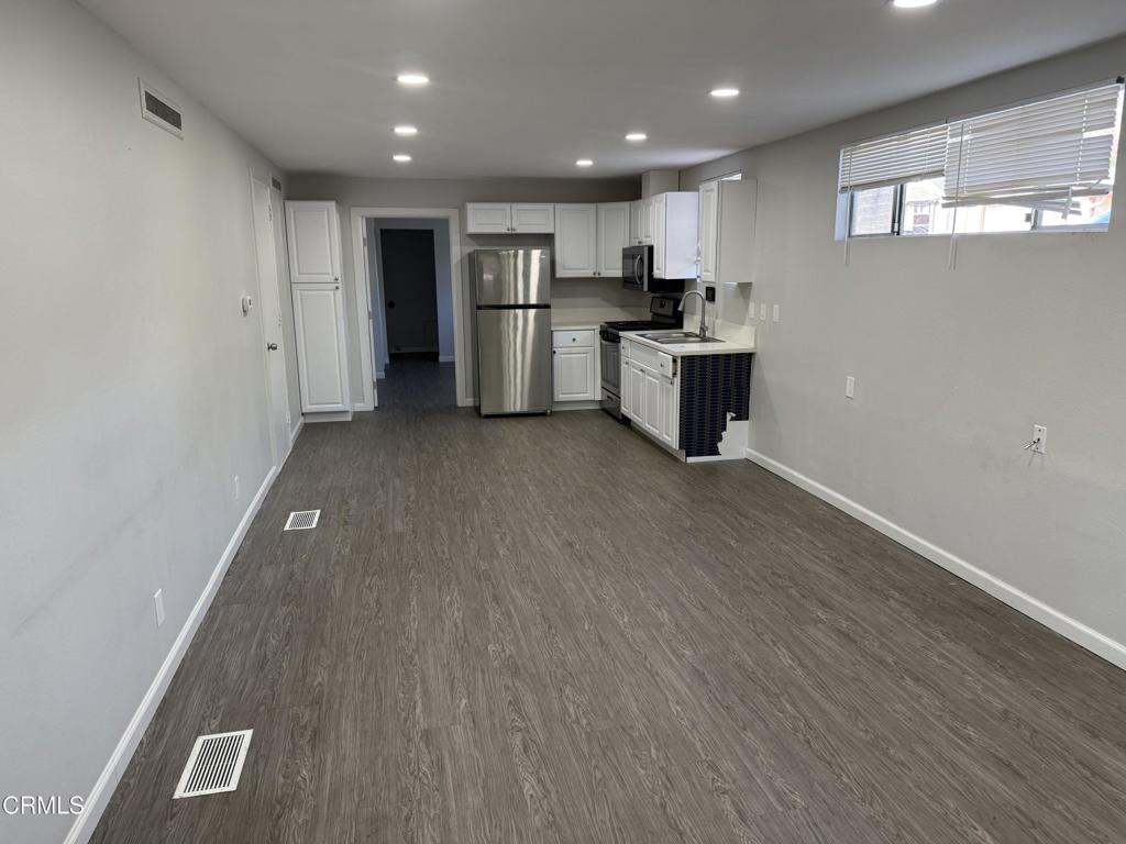 600 Central Street Fillmore, CA 93015 - Photo 9 of 13 a kitchen with stainless steel appliances a refrigerator and a microwave