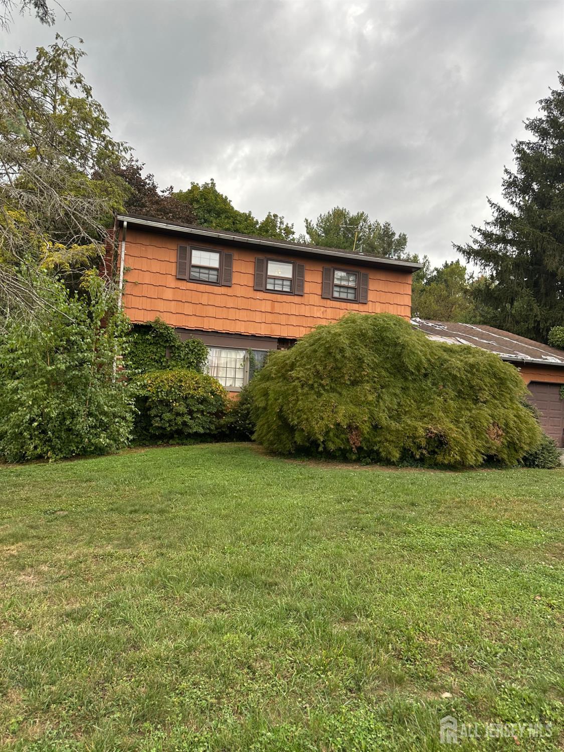 16 Hershey Road East Brunswick, NJ 08816 - Photo 1 of 15 a front view of a house with a yard