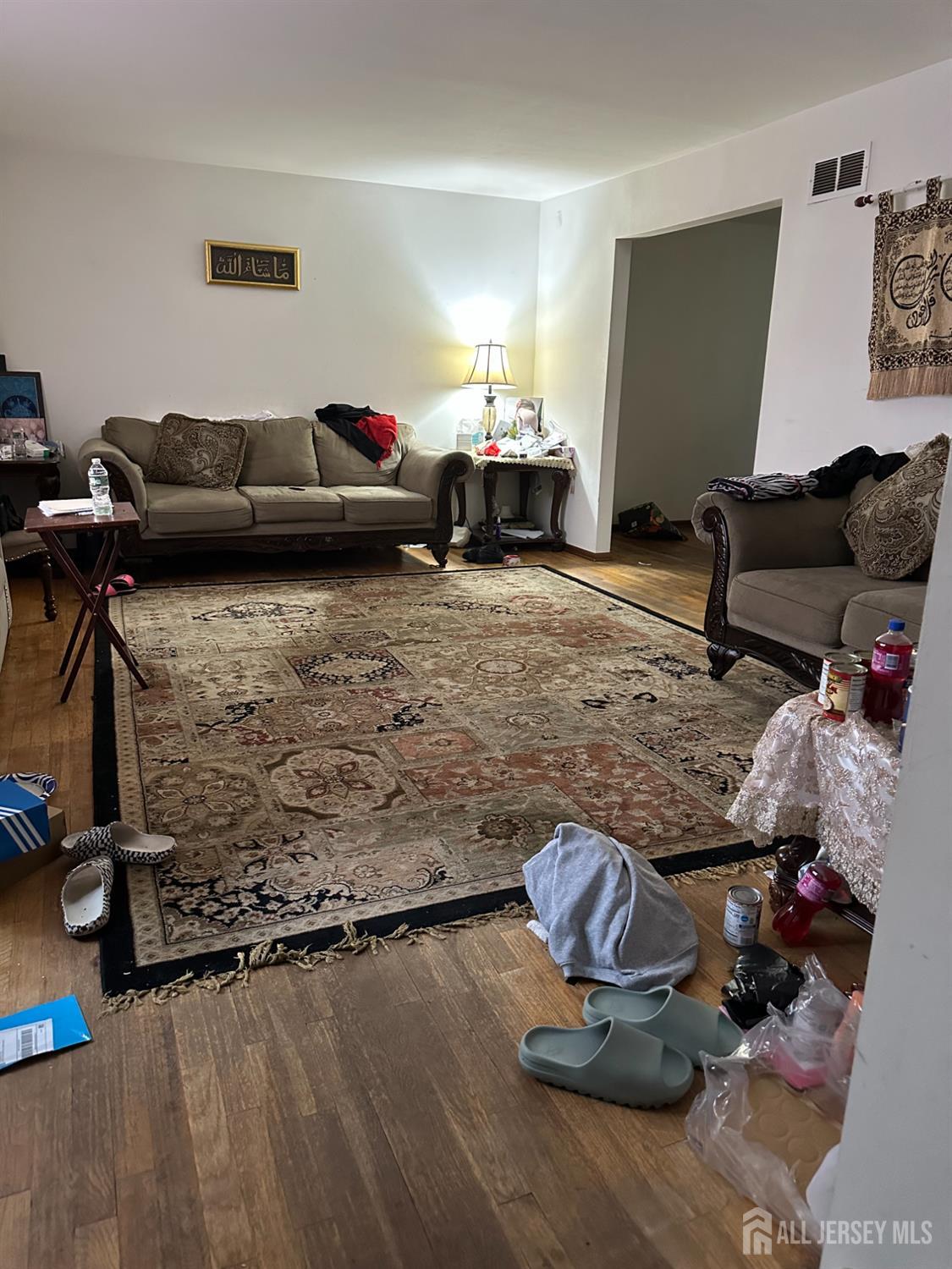 16 Hershey Road East Brunswick, NJ 08816 - Photo 15 of 15 a living room with furniture and a wooden floor