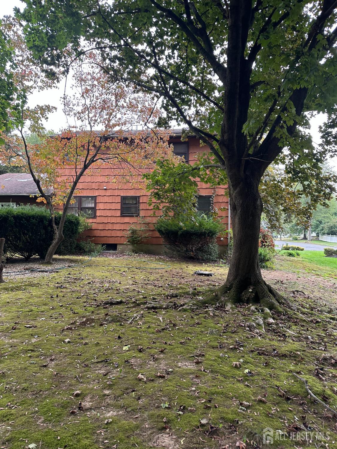 16 Hershey Road East Brunswick, NJ 08816 - Photo 4 of 15 a view of a house with a yard
