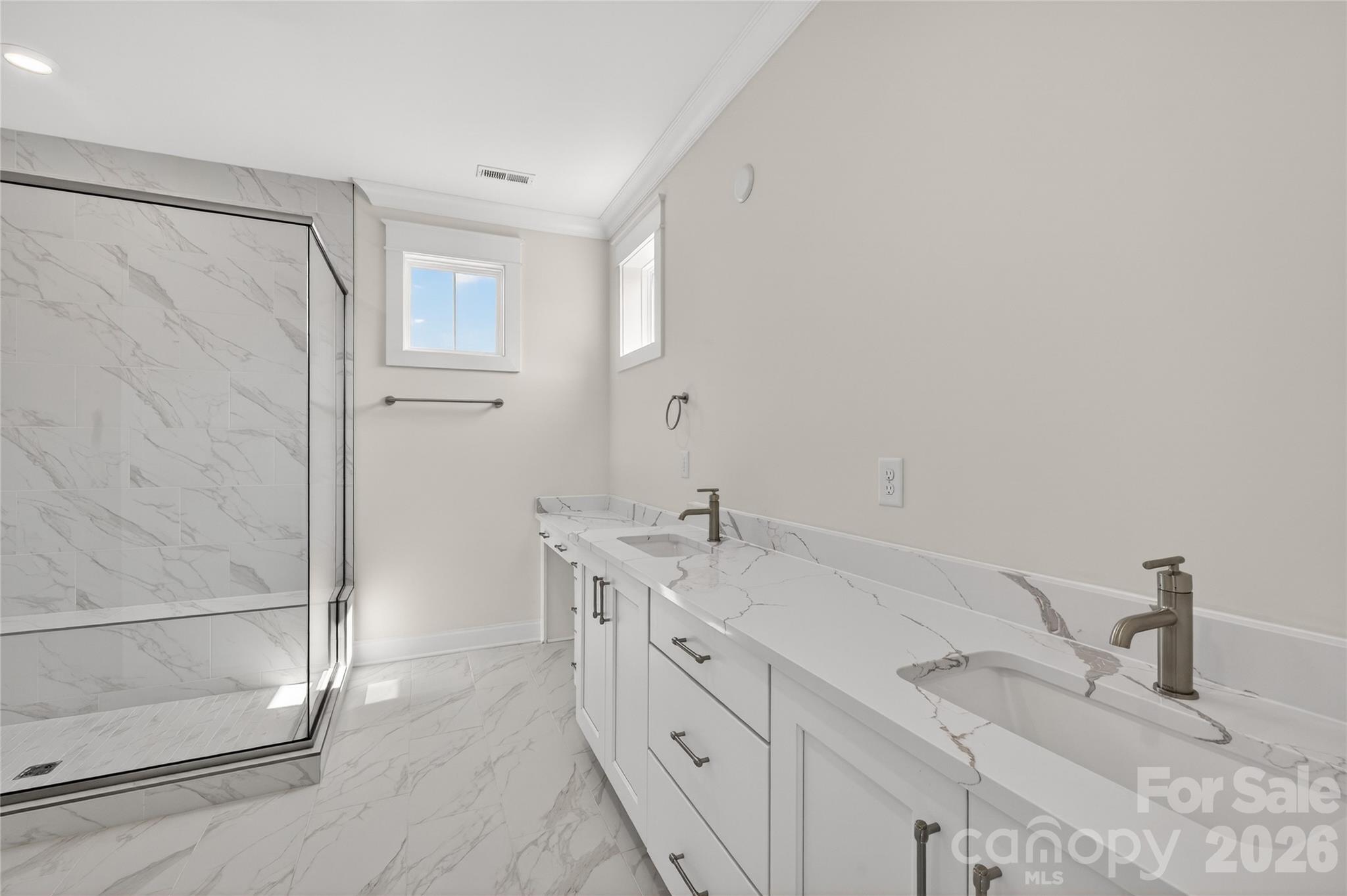 355 Linda Carol Lane Tega Cay, SC 29708 - Photo 11 of 15 a spacious bathroom with double vanity sink and a mirror