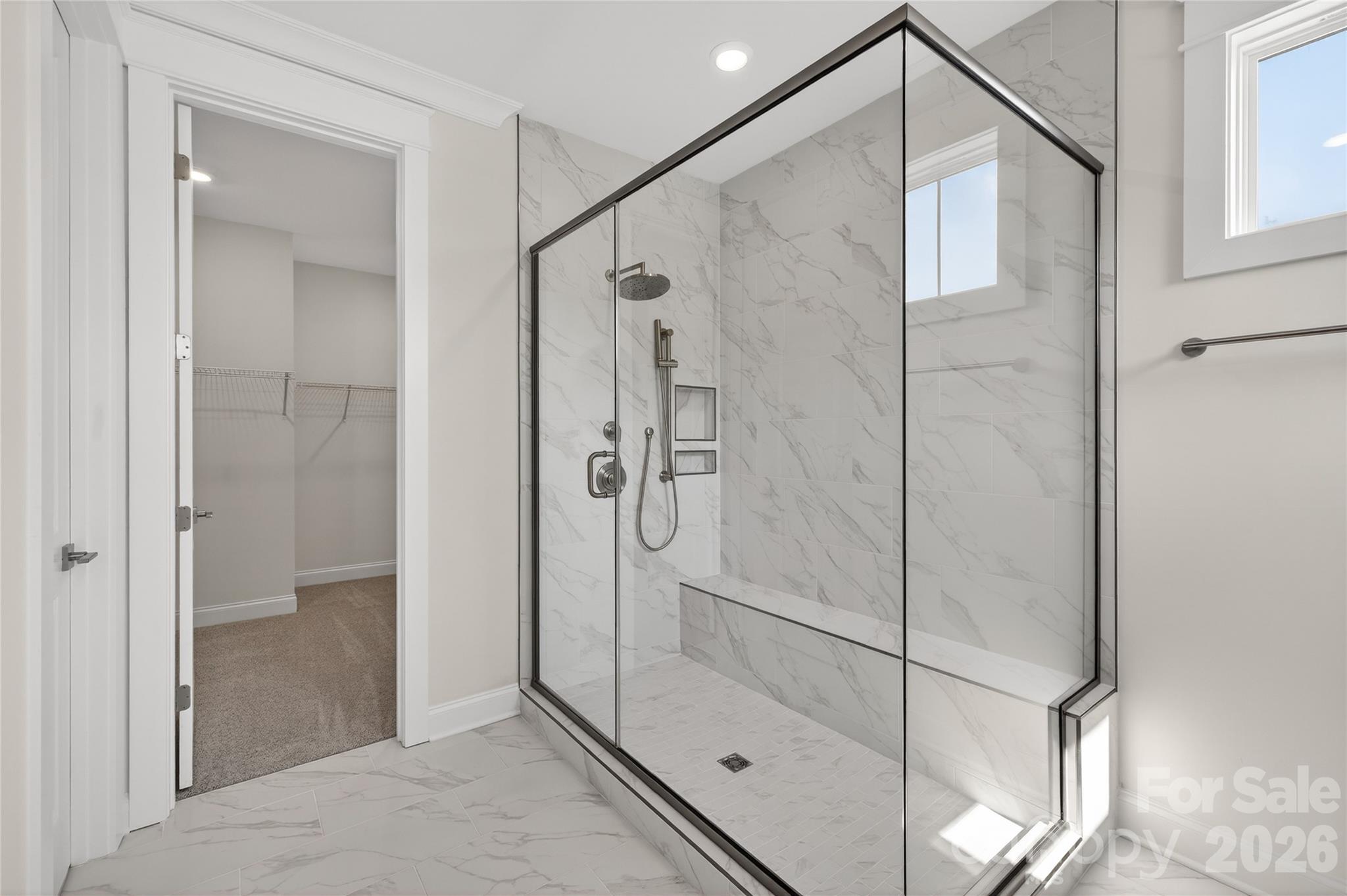 355 Linda Carol Lane Tega Cay, SC 29708 - Photo 12 of 15 a bathroom with a shower and a glass door