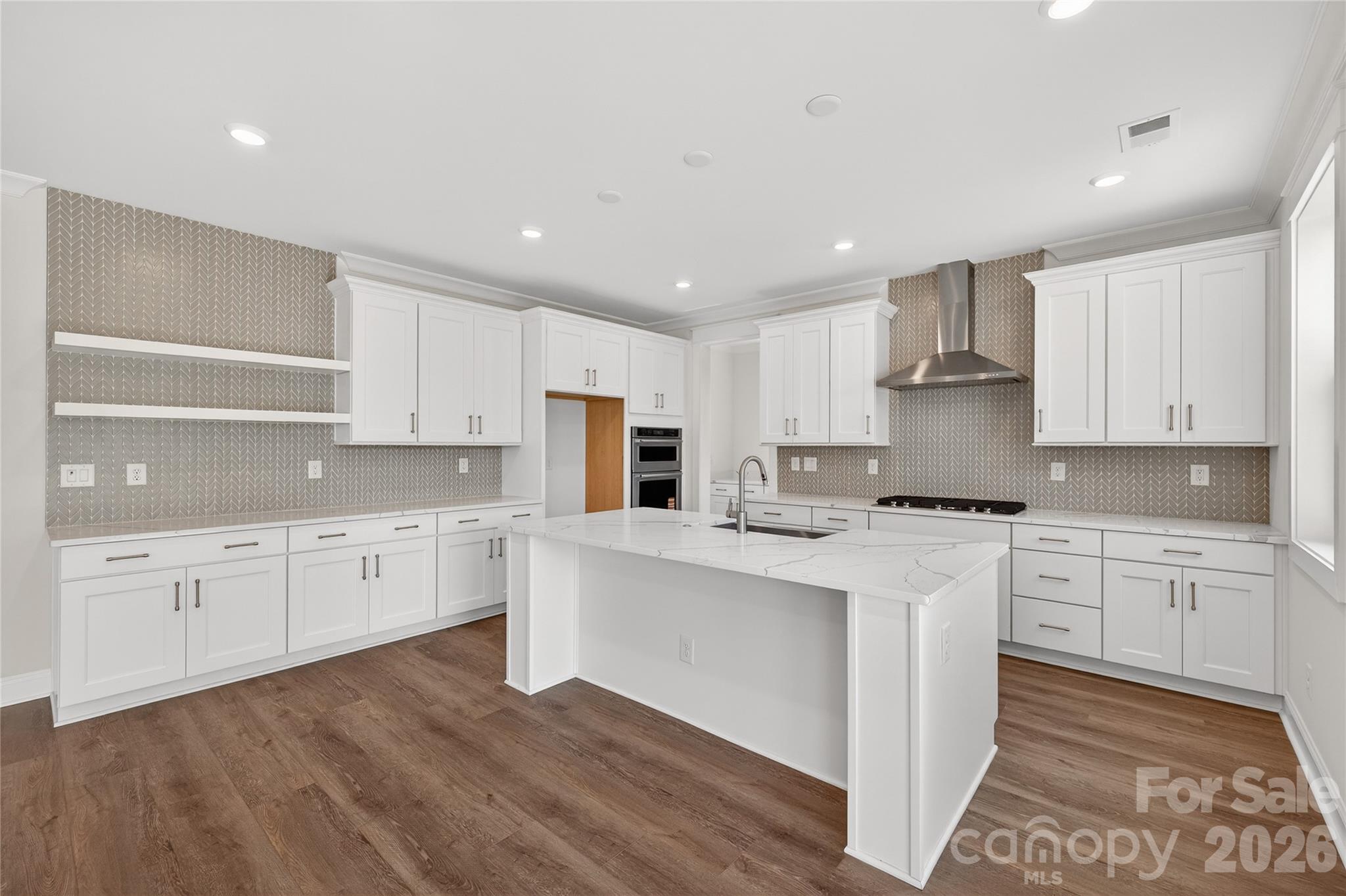 355 Linda Carol Lane Tega Cay, SC 29708 - Photo 3 of 15 a large kitchen with stainless steel appliances cabinets a sink and a stove