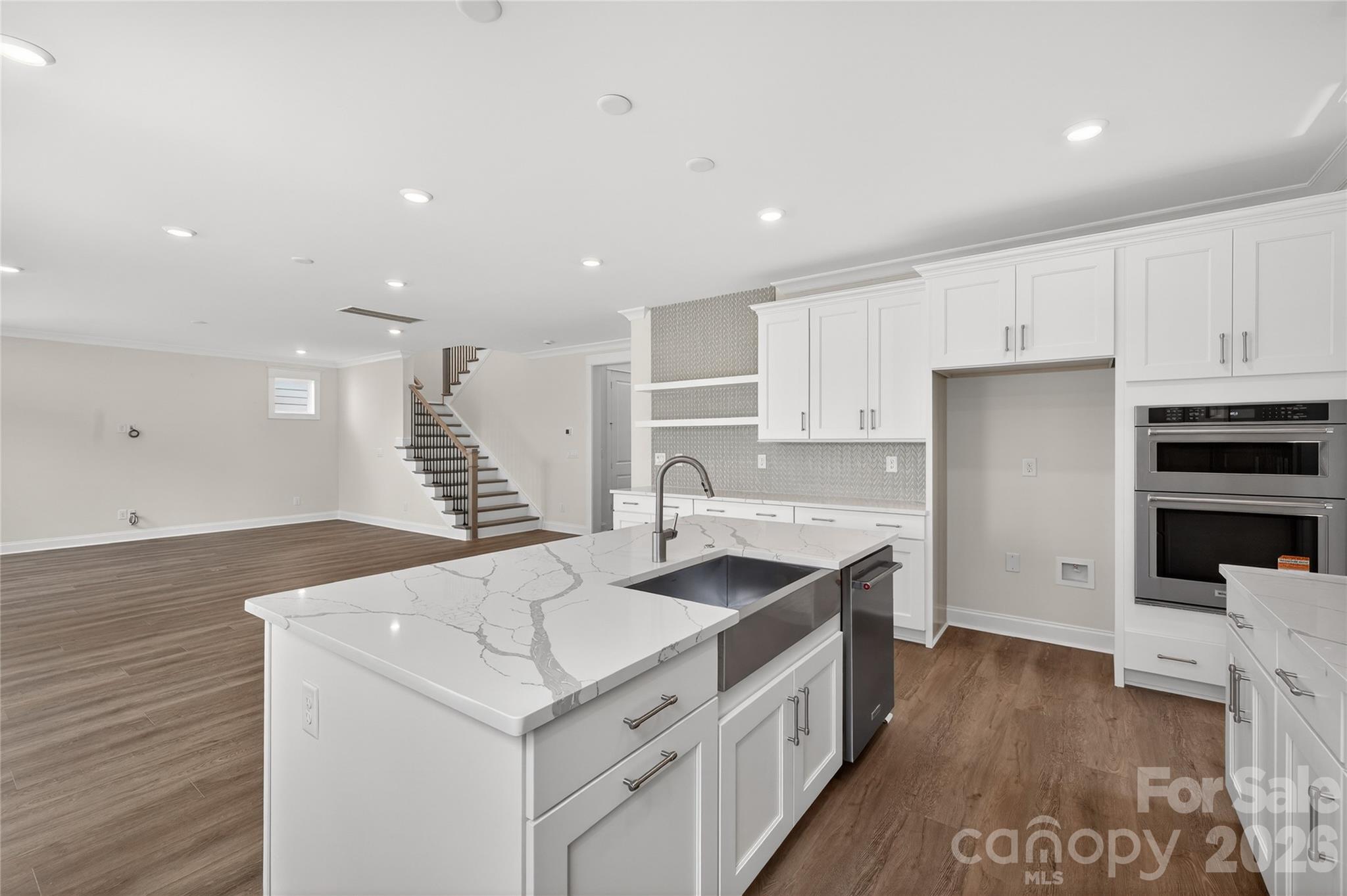 355 Linda Carol Lane Tega Cay, SC 29708 - Photo 5 of 15 a kitchen with a sink stove and cabinets