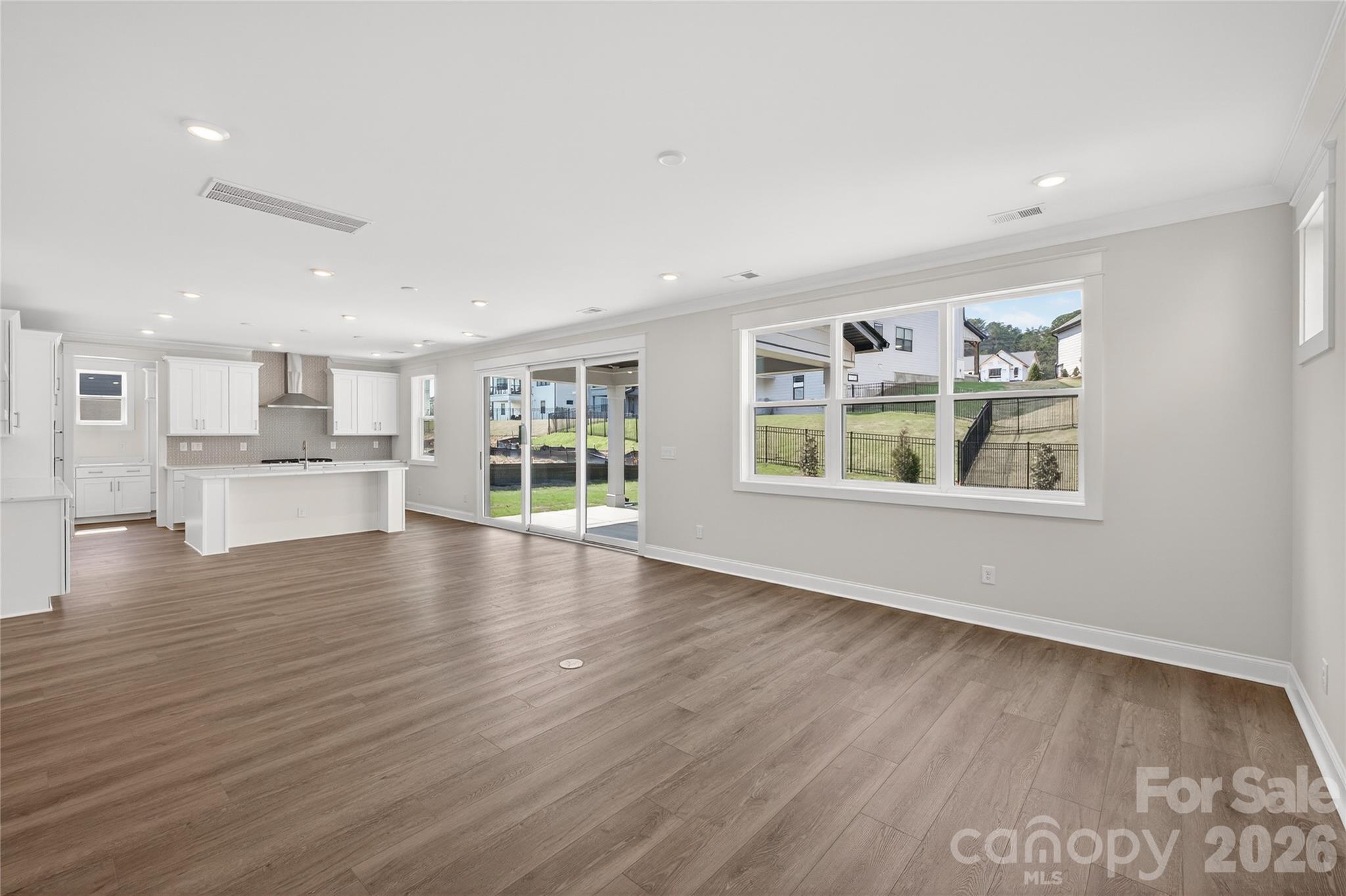 355 Linda Carol Lane Tega Cay, SC 29708 - Photo 6 of 15 a view of an empty room with window and wooden floor