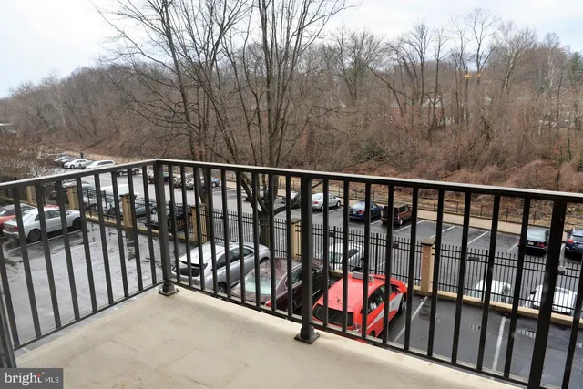 a balcony with trees in front of it