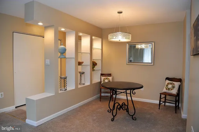 a view of a livingroom with furniture and a chandelier