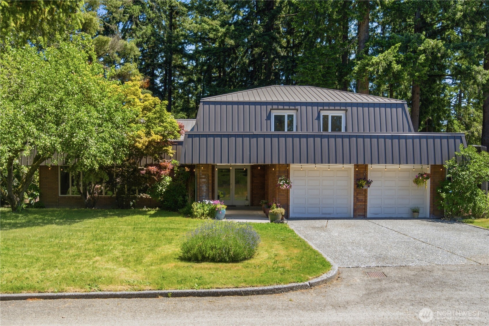 a front view of a house with garden