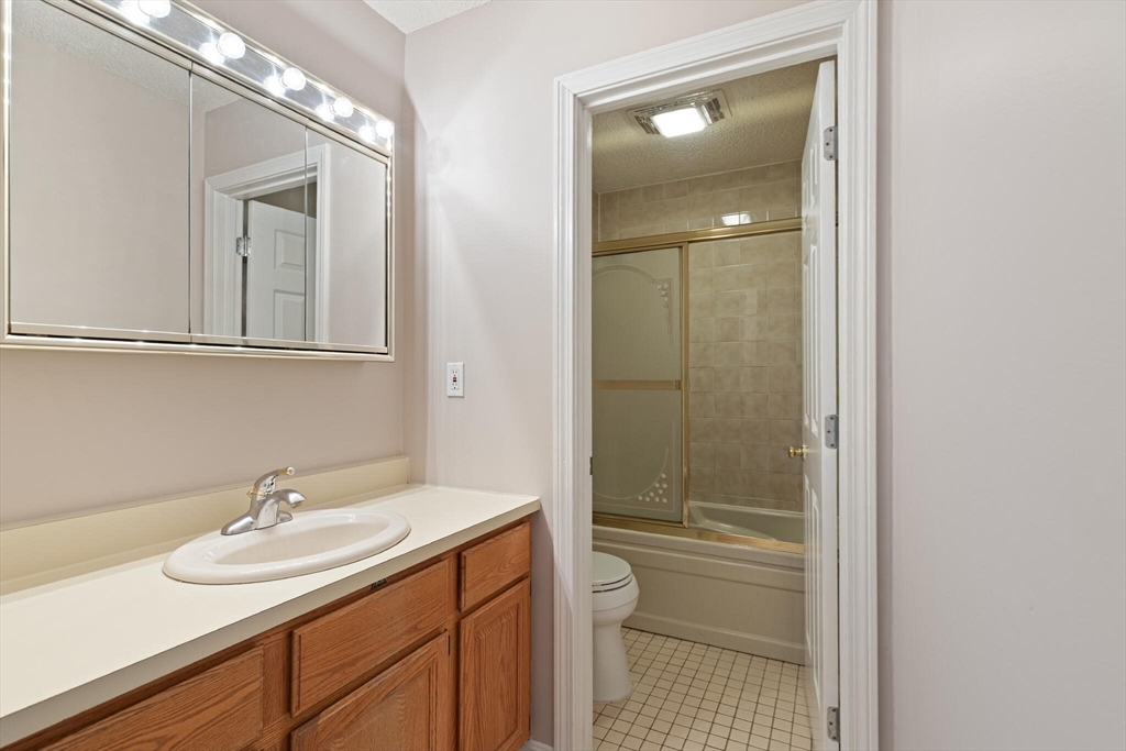 6 Countryside Lane, Unit 1303 Salem, MA 01970 - Photo 13 of 26 a bathroom with a sink a toilet and shower