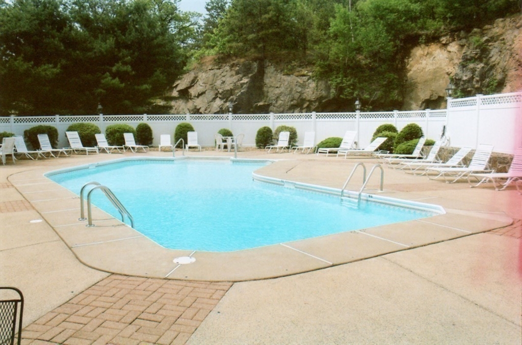 6 Countryside Lane, Unit 1303 Salem, MA 01970 - Photo 25 of 26 a view of a swimming pool with furniture