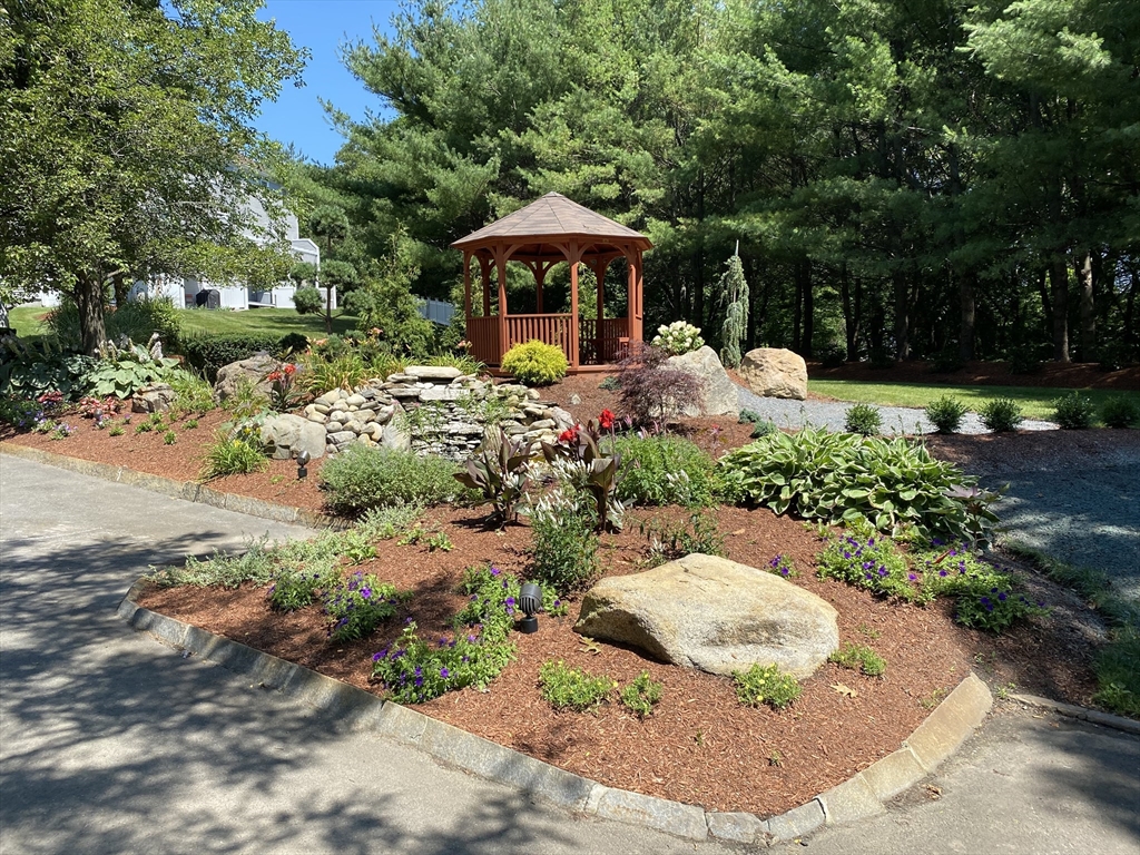 6 Countryside Lane, Unit 1303 Salem, MA 01970 - Photo 26 of 26 a front view of a house with a yard and lake
