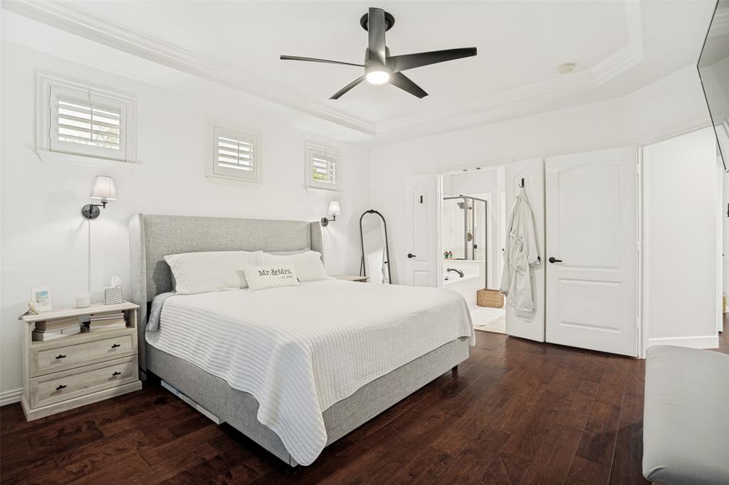 1612 Coventry Lane Allen, TX 75002 - Photo 10 of 39 Bedroom featuring rich wood-finish flooring and bright white walls