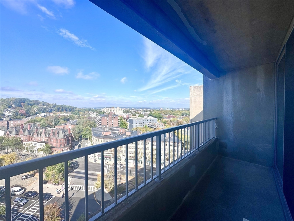 133 Park Street, Unit 703 Brookline, MA 02446 - Photo 6 of 25 a view of city and mountain from a balcony
